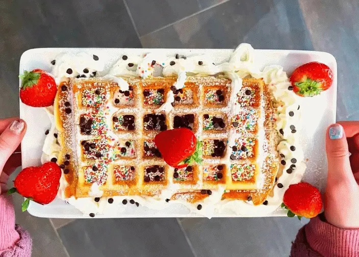 Freshly baked Belgian waffles with toppings