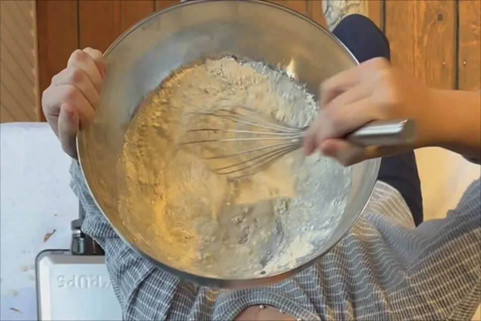 Mixing Belgian waffle batter during a workshop