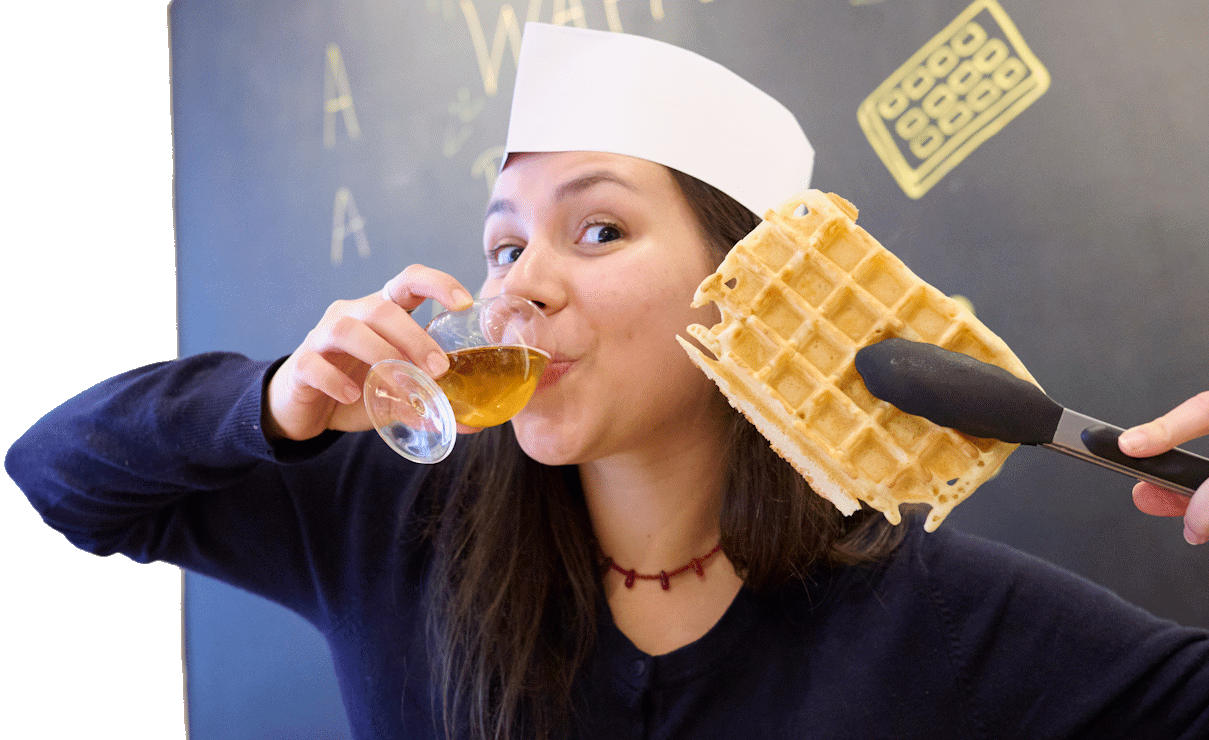 Participant enjoying a Belgian beer tasting during the Waffle + Belgian Beer Workshop