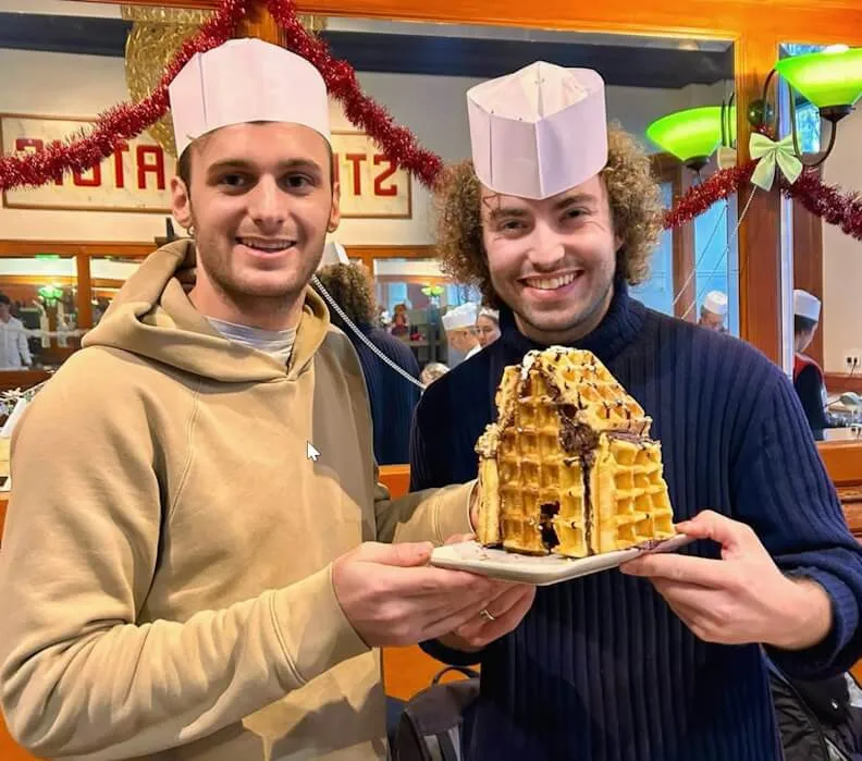Participants building a house out of Belgian waffles